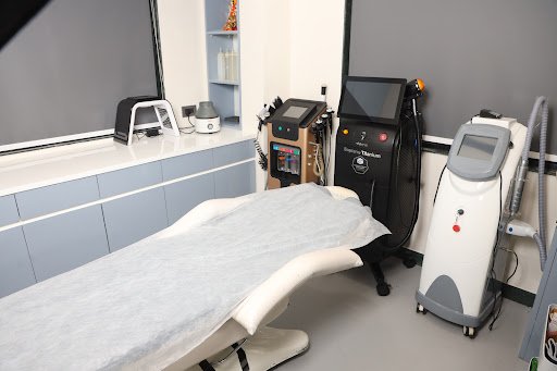 Modern laser treatment room with clinic equipment